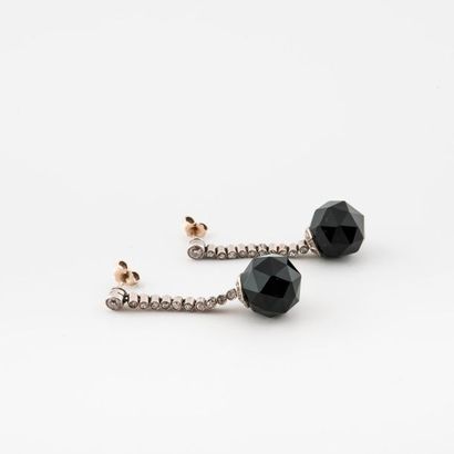 Pair of earrings in white gold (750) and...