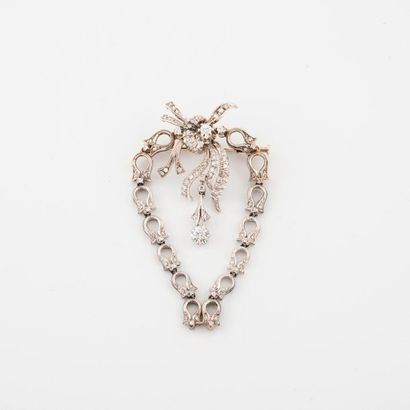 Bow brooch in white gold (750) holding a...