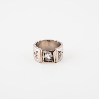 A platinum signet ring (850) centered with...