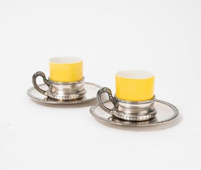 
Pair of silver cup holders and saucers (950)...