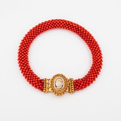 Crew-necklace made of a braid of red coral...