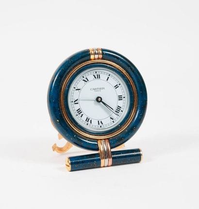 CARTIER


Travel alarm clock in gold plated...