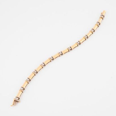Bracelet articulé en ors jaune et gris (585)...