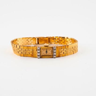 Ladies' bracelet watch in yellow and white...