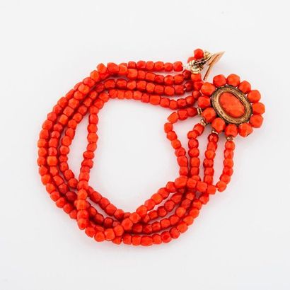 Bracelet with four rows of faceted coral...