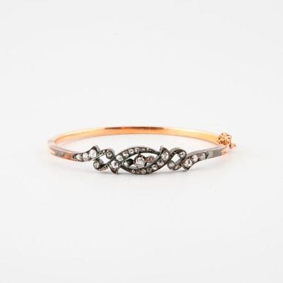 Yellow gold (750) and silver (min. 800) openwork...