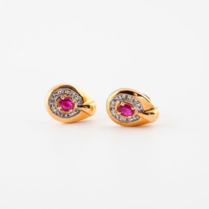 Pair of yellow gold (750) ear studs centred...