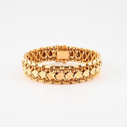 Articulated ribbon bracelet in yellow gold...
