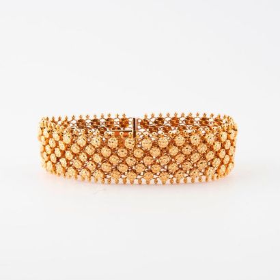 Articulated ribbon bracelet in yellow gold...