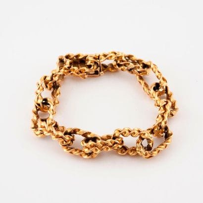 Bracelet in yellow gold (750) with braided...