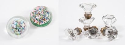 Two paper-press balls in colourless glass...