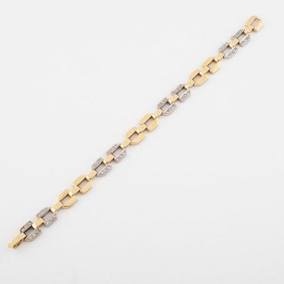 Bracelet articulé en ors jaune et gris (750)...