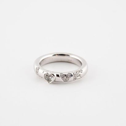 Bague jonc en or gris (750) ornée d'un diamant...