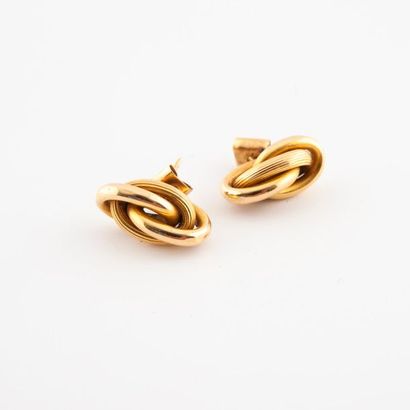 Paire de puces d'oreilles noeuds en or (750)...