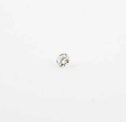 Small brilliant-cut diamond on paper. 

Diamond...