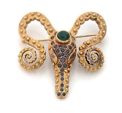 Broche en or jaune (750) stylisant une tête...
