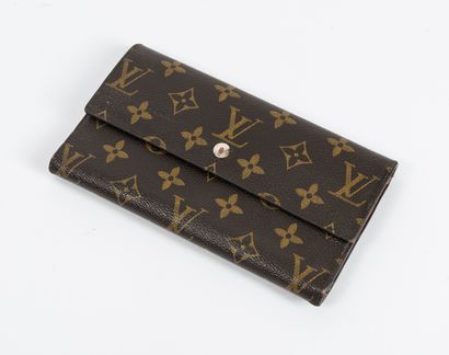 LOUIS VUITTON
Portefeuille en toile Monogram....