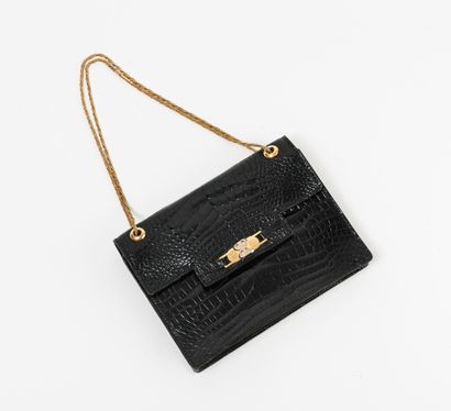 BALENCIAGA
Sac du soir en cuir noir façon...