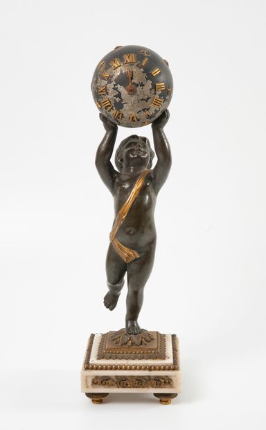 
A patinated bronze and gilt bronze clock,...