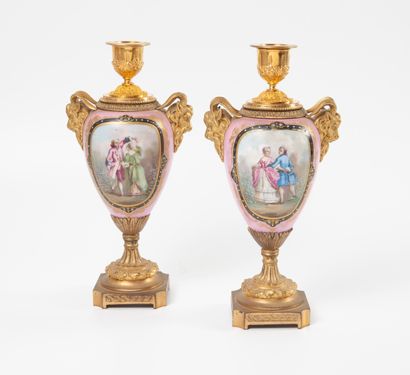 
A pair of porcelain and gilt bronze torch...