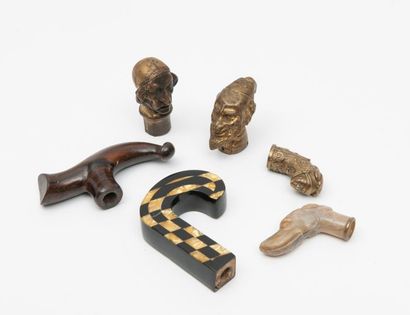 Four pommels and a cane handle:
- two in...