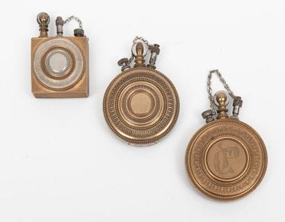 Three petrol lighters.
Brass cases decorated...