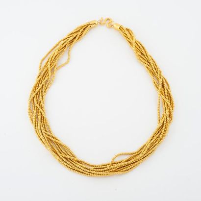Necklace made of nine rows of small yellow...