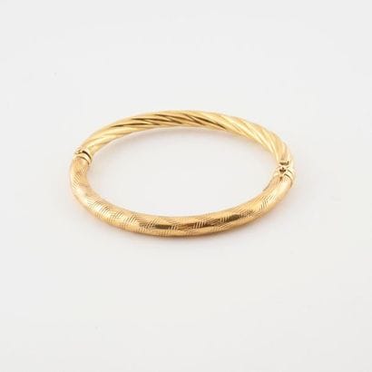 Bracelet jonc ouvrant en or jaune (750) creux,...