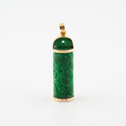 Yellow gold pendant (585) holding a carved...