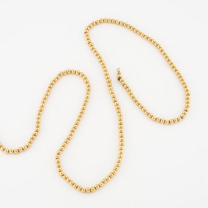 Yellow gold pearl necklace (750). 
 Handcuff...