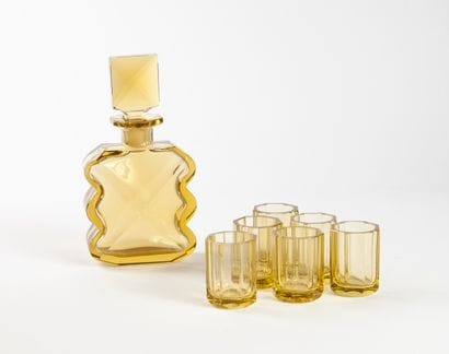 Liqueur service.

In yellow glass composed...