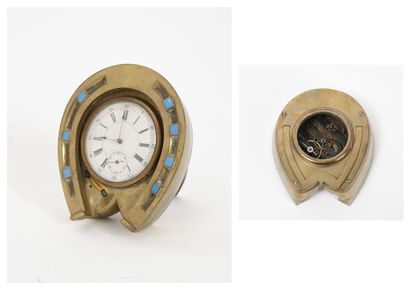 Brass desk clock, on an easel, in the shape...