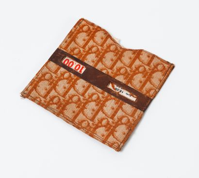 CHRISTIAN DIOR
Parking disc pocket in brown...