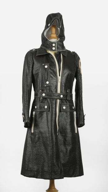 COURREGES
Long vinyl coat with lined hood....