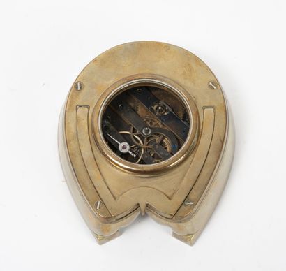 Brass desk clock, on an easel, in the shape...