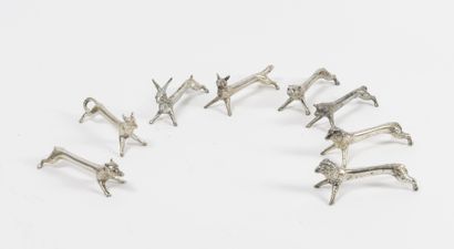 Set of 8 silver plated knife holders featuring...