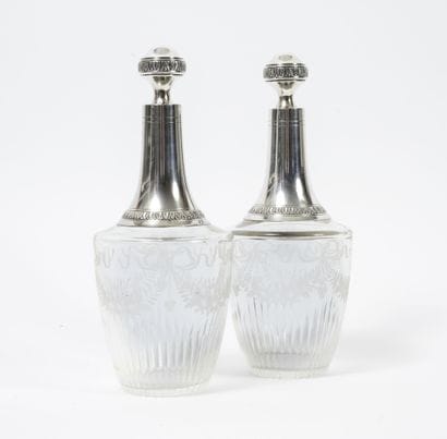 A pair of cut and engraved glass decanters...