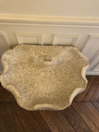 A stone and reconstituted stone wall fountain...