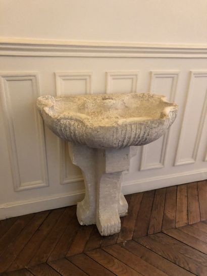 A stone and reconstituted stone wall fountain...