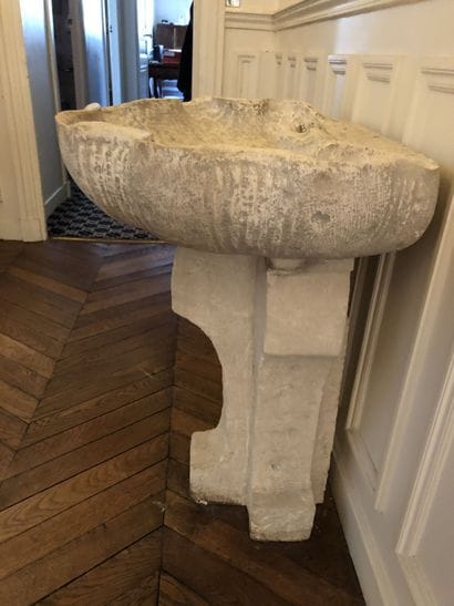 A stone and reconstituted stone wall fountain...