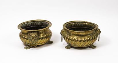 A pair of brass planters or braziers standing...