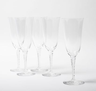 LALIQUE, France
Set of five champagne flutes,...