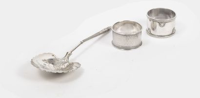 Three silver coins (950) :

- Two napkin...