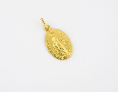 Small miraculous medal in yellow gold (750).

Weight...