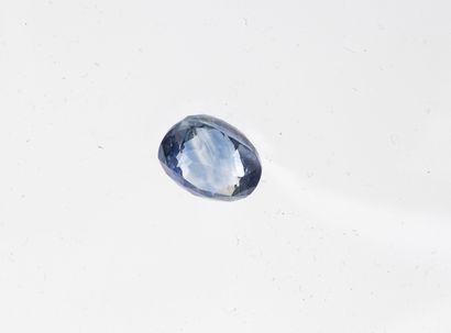 Faceted oval sapphire on paper. 

Weight...