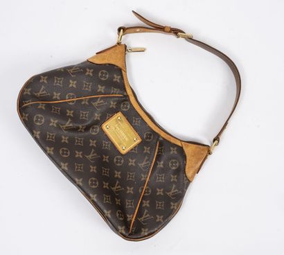 LOUIS VUITTON
Monogrammed canvas and tan...