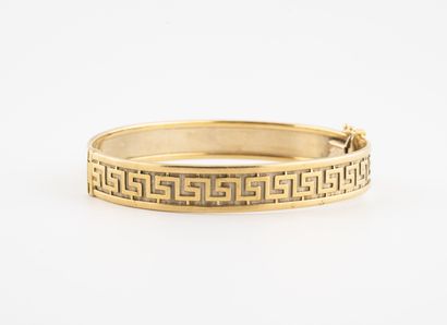 Yellow gold (750) bangle bracelet with a...