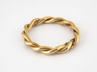 Yellow gold bracelet (750) twisted. 

Ratchet...