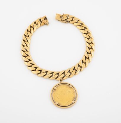 
Bracelet gourmette en or jaune (750) retenant...