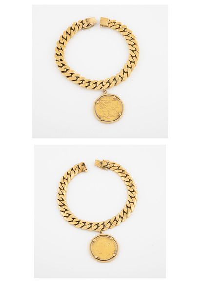 
Bracelet gourmette en or jaune (750) retenant...